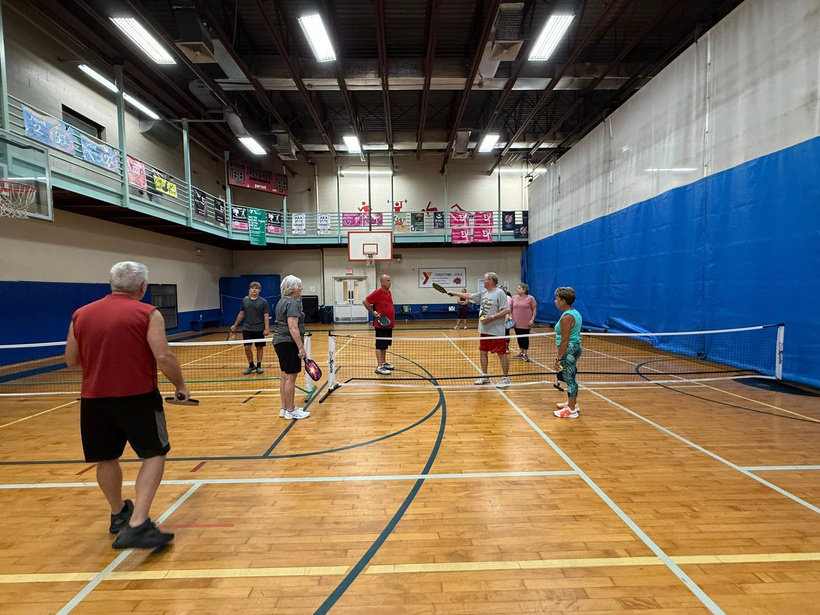 Pickleball players in current gym